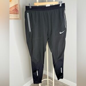 Nike Black Jogger Pants with White Swoosh and Reflective Trim